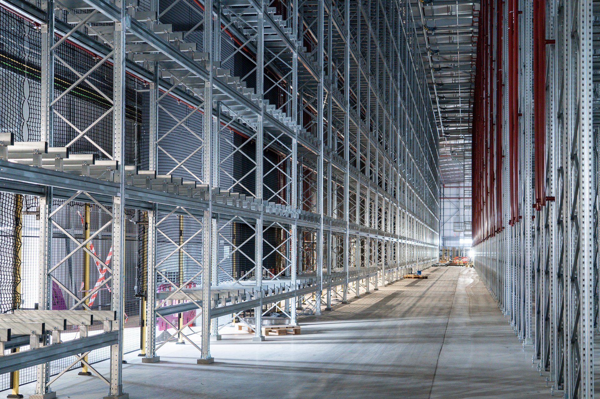 Compliant high-bay racking